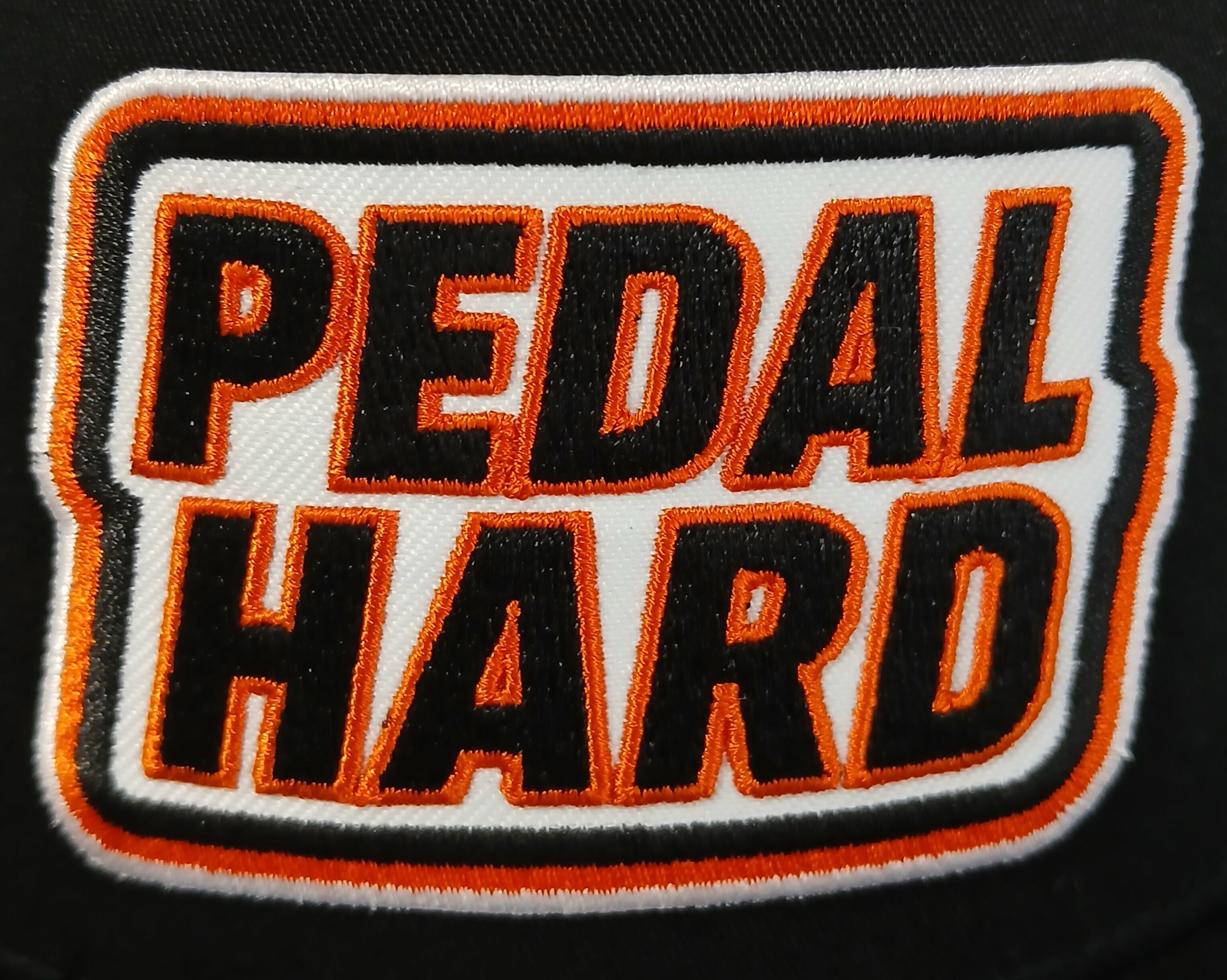 PEDAL HARD embroidered logo patch detail on Cityline Trucker snapback hat black streetwear hat for BMX MTB and cycling riders