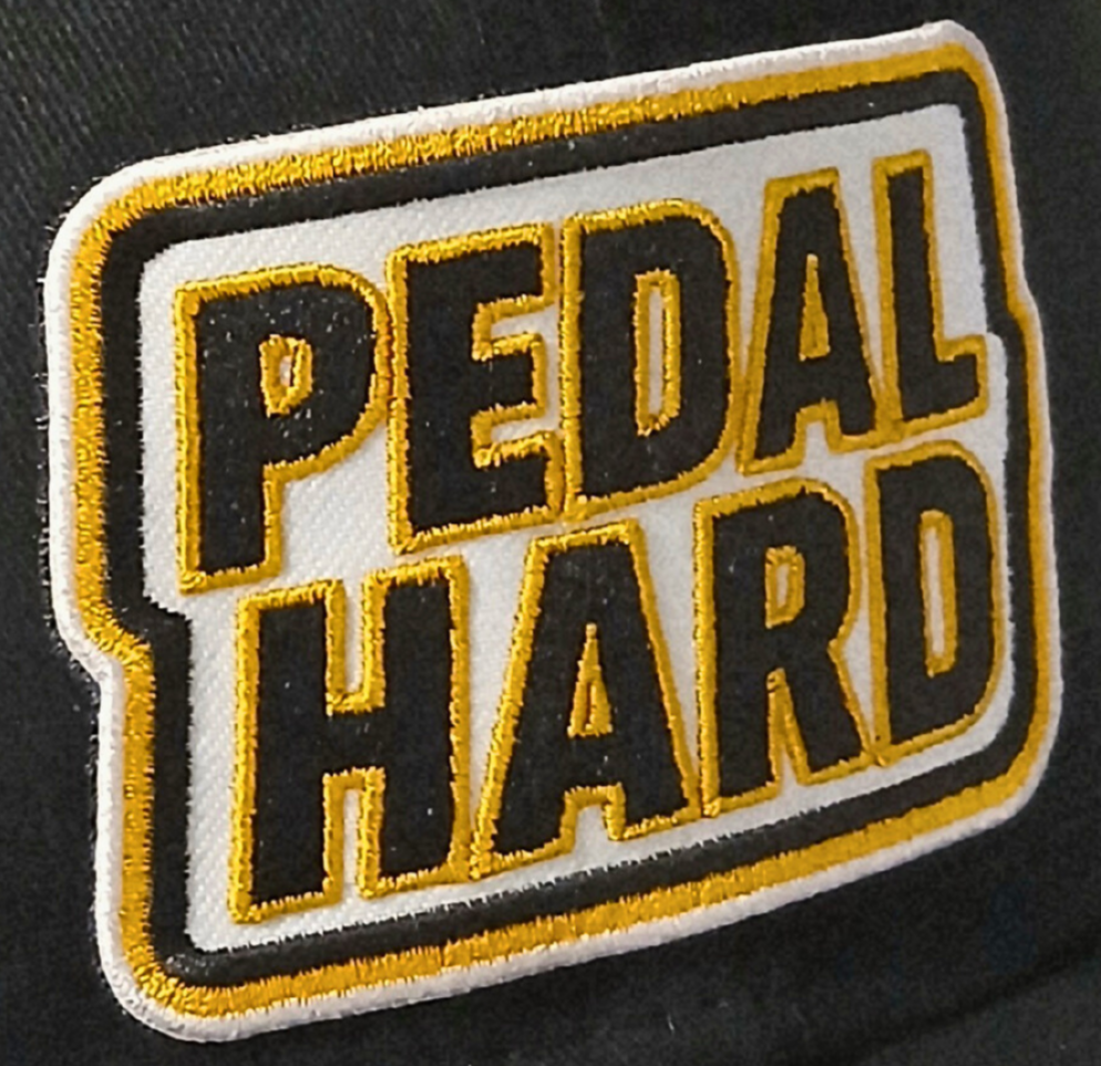 PEDAL HARD embroidered logo patch on Hardline Trucker cycling hat